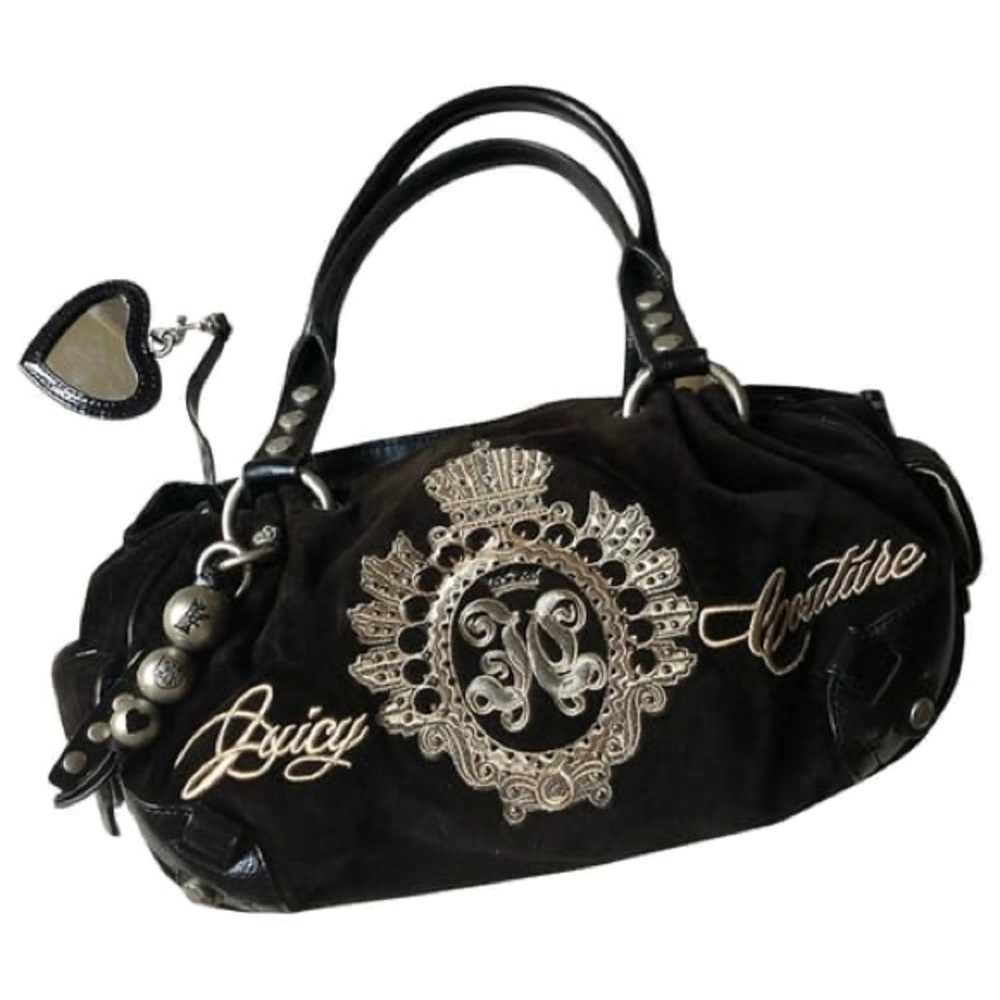 Black Juicy couture handbag~Is missing the original heart.In great condition!